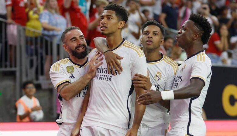 Bellingham (second right) joined by teammates to celebrate his opener for Real Madrid