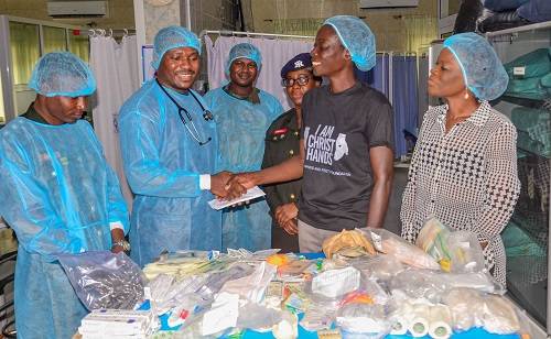 Ms Akosua Sarpong (second from right) presenting the donation to Lt Cdr Nyarko