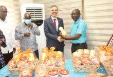 Mr Ken Ofori-Atta (right) presenting the items to Ambassador Huseyin Gungor (third from left).With them are officials of the ministry. Photo. Ebo Gorman