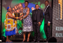 Grace Isaac Aryee, Treasurer, FBNBank, receiving the award from Nana Awo Ama Sakyibea, Ankobea Hemaa, Akropong Aboasa. Looking on are Allen Quaye and Enoch Vanderpuye (right)