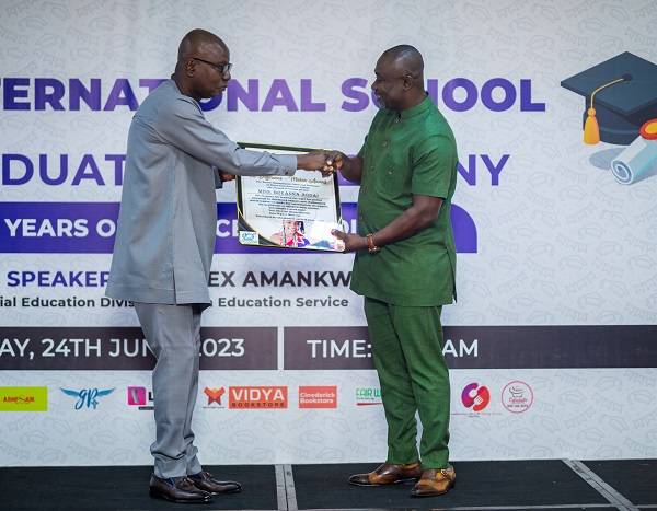 • Mr Addai (right) receiving the award on behalf of late Breanna
