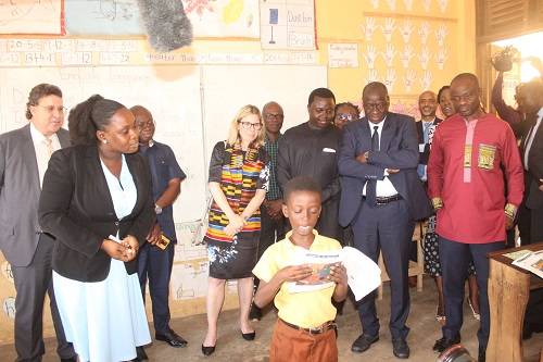 -A class two pupil from New Gbawe MA 1 basic school reading a story book to the World Bank delegation during the visit to the GALOP centre. Photo. Ebo Gorman