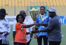 GARFA chairman, Mr Samuel Aboabire (right) presenting the trophy to skipper of Epiphany Warriors Gifty Acheampong