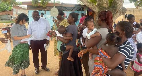 Mr Adomako (second from left) engaging some nursing mothers during an outreach programme in the district