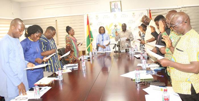 • Mrs Abena Osei-Asare (middle from left) inaugurating the members at the programme. Photo: Ebo Gorman