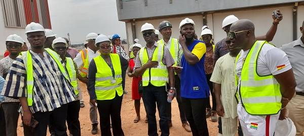 • The Minister (left) and other officials at the Legon Sports Stadium
