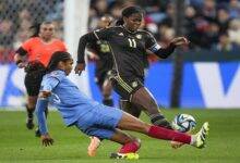 Khadija Shaw (11) is challenged by a France defender in their group game yesterday