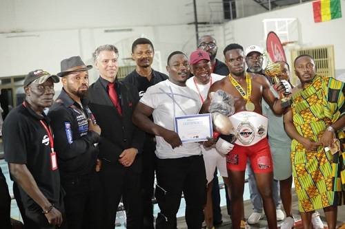 • MMA champion, Jonathan Lamptey, (second right with trophy) with dignitaries and organisers after the event