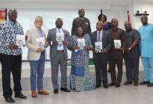 • Akosua Frema Osei-Opare (middle), with Mr Kwaku Agyemang Manu (fourth from right) and other dignitaires displaying copies the policy document