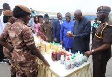 Mr Ambrose Dery(second from right) inspecting products manufactured by the inmates,with him are Isaac Egyir (right) and other dignitaries