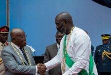 • President Akufo-Addo (left) exchanging greetings with Liberia President George Manneh Oppong Weah