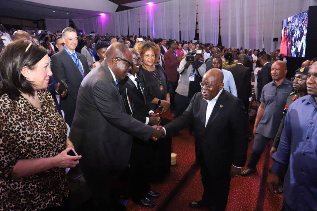 President Akufo-Addo (right), interacting with dignitaries at the Full Gospel Business Men's Fellowship International conference in Accra      