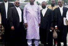 Alhaji Malik Ibrahim (middle) and his legal team after court proceedings