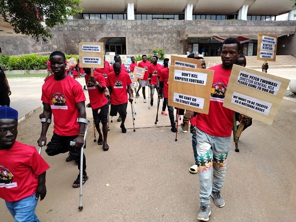 • The amputee footballers leaving the National Theatre area to the court