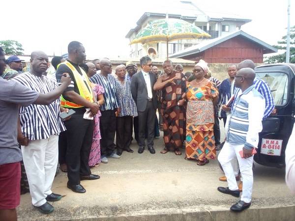 Togbe Afede inspecting the damage during a tour in the town