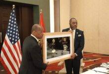 Dr Mathew Opoku Prempeh (right) presenting a plaque to Mr Sylvester Turner