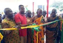 Inset, Mr Bobie (second from left) being assisted by other dignitaries to cut the tape to inaugurate the ward.