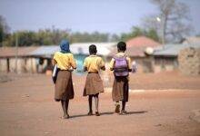 Students contemplating their journey to school Photo: Geoffrey Buta