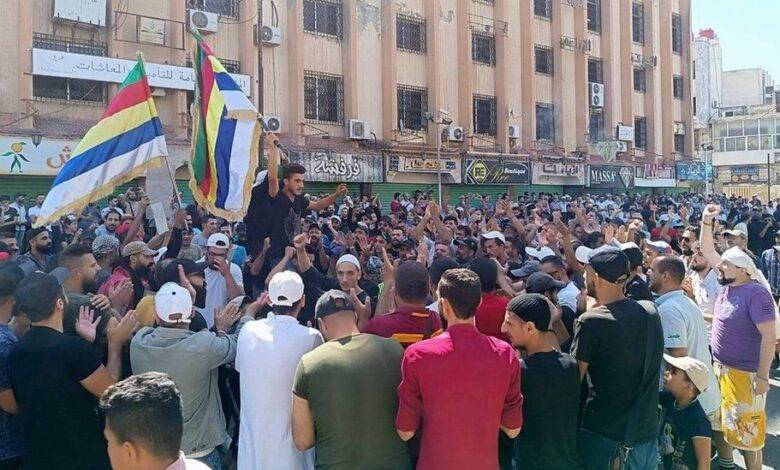 • A photo from activist collective, Suwayda24, showed protesters waving Druze flags in Suweida's al-Sayr square on Tuesday