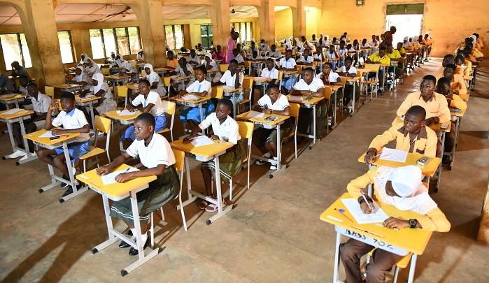 Some candidates at the Kalpohine Senior High School writing their RME paper. Photo Geoffrey Buta