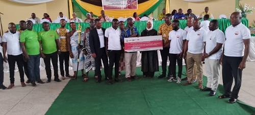 The cheque being presented to the beneficiaries