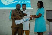 • Mr Dwumfour handing over copies of the GJA Code of Ethics to Dr Gifty Appiah-Adjei after the seminar