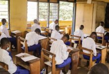 Prison inmates writing the BECE exams