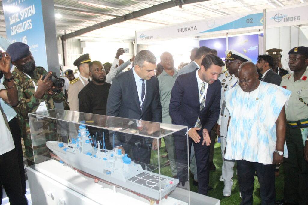President Akufo-Addo (in smock) being briefed at the exhibition stands by Mr Deniz Yilmaz,Africa Regional Manager,Aselsan Elektronik .Photo. Ebo Gorman 