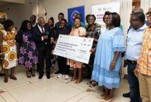 Mr K.T. Hammond (third from left) unveiling the fund together with other dignitaries and beneficiaries
