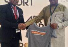 Mr Nkoo Joseph (left) presents a T-shirt to Mr Fianoo after the event