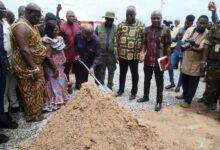 President Akufo-Addo (with shovel) cutting the sod for the commencement of work on the Pokuase housing project