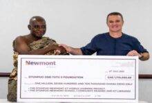 • Mr Thornton (right) presenting the cheque to Nana Prof. Boachie-Adjei Woahene II