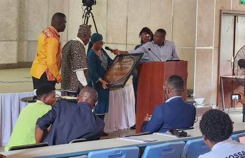 Prof Tarr(third left) handing over the plaque to Dr Braimah(second left) while other officials look on
