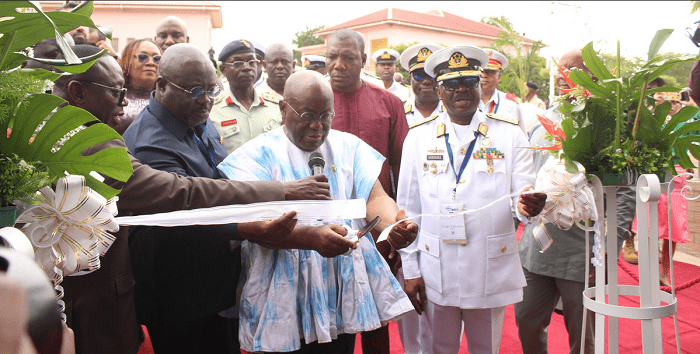 President Akufo-Addo (middle) cutting a tape to officially open the IMDEC at Burma Camp in Accra. With him is Vice Admiral Amoama(right),Chief of Defence Staff.Photo. Ebo Gorman