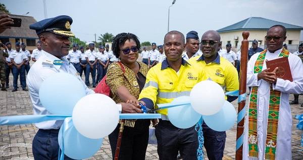 Inset; Mr Twum (third from right) and Air Commodore Parker (left) inaugurating the tractor