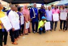 Mr Kanor(middle) with Adangbe and Some awardees displaying their citations after the programme