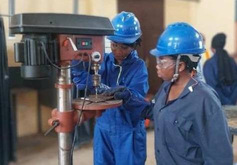 Janet Serwaa Setugah and her colleague operating a wielding machine at the AVTI