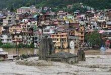 A temple is submerged in floodwaters after the river Beas overflowed in Mandi