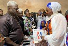 Hajia Abdul-Aziz presenting her nomination forms to chairman of the elections committee, Alhaji Alhassan Diare