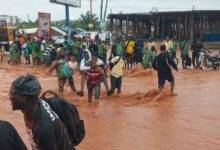• Some of the students being carried through the floods