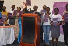 Prof Justice S.K Date-Bah(middle)with some youth launching the report. Photo Godwin Ofosu-Acheampong