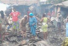 • Residents and fire personnel at the gutted area