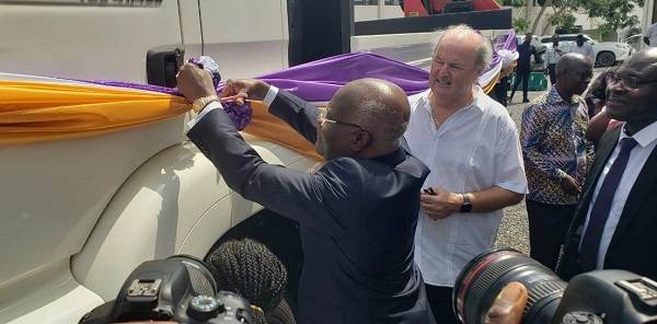 Mr K.T Hammond unveiling the truck. With him is Mr Thomas A. Vis