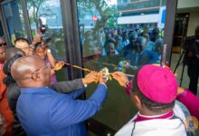 Inset, Dr Bawumia being assisted by Rev. Boafo and other ministers to cut the tape for the opening of the edifice
