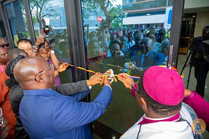 Inset, Dr Bawumia being assisted by Rev. Boafo and other ministers to cut the tape for the opening of the edifice