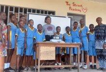 Ms Yvonne Abba-Opoku (middle) with Ataa Lartey (extreme right) and a some of the school children