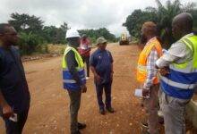 Dr Archibald Letsa (middle) with other dignitaries inspecting the road after it was open to traffic