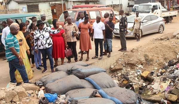 • Dr Freda Akosua Prempeh pointing to a heap of refuse to the assembly environmental officers during her visit at Kakudi in Nima-Mamobi. Photo: Ebo Gorman