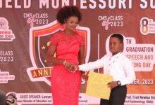 Ms Dzifa Adjanu presenting one of the pupils with his award