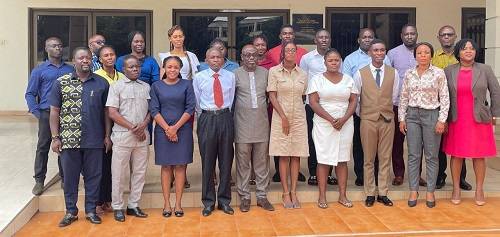 Mr Nsiah (sixth from right) in a group photograph with some of the participants after the training programme